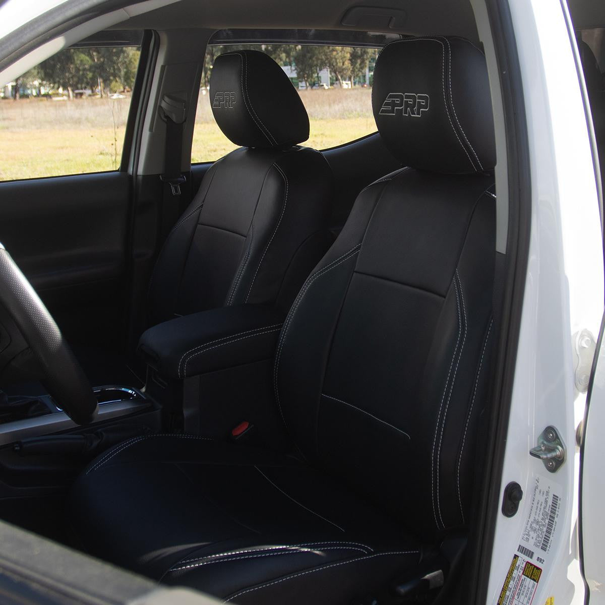 Front Seat Covers for 2016-2023 Toyota Tacoma with Electric Seat Adjusters (Pair) - Black with Red Stitching
