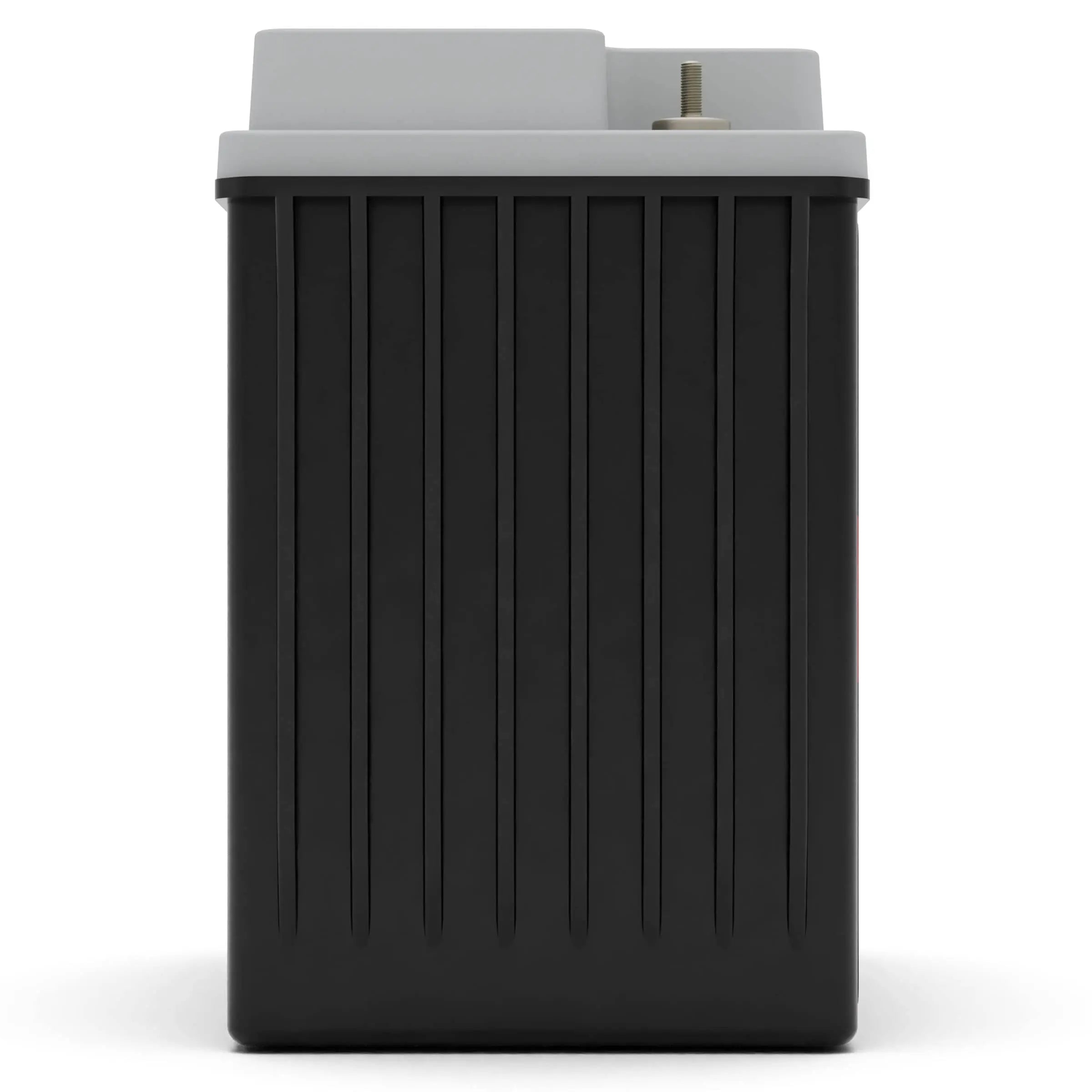 A black rectangular car battery with vertical grooves, topped with a gray cap and a visible terminal.