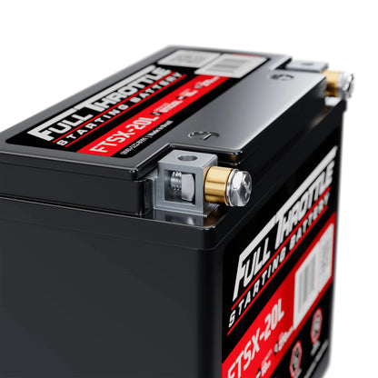 Close-up of a Full Throttle FTSX20L starting battery, showing terminals and label with specifications.